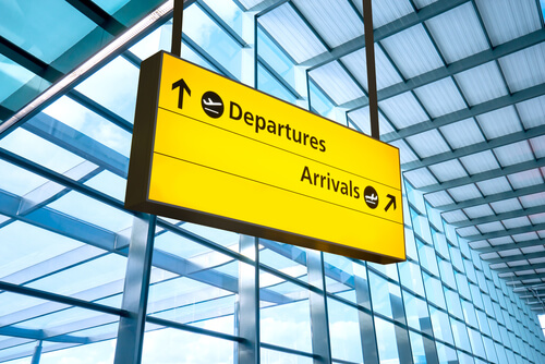 departure and arrival sign at heathrow airport